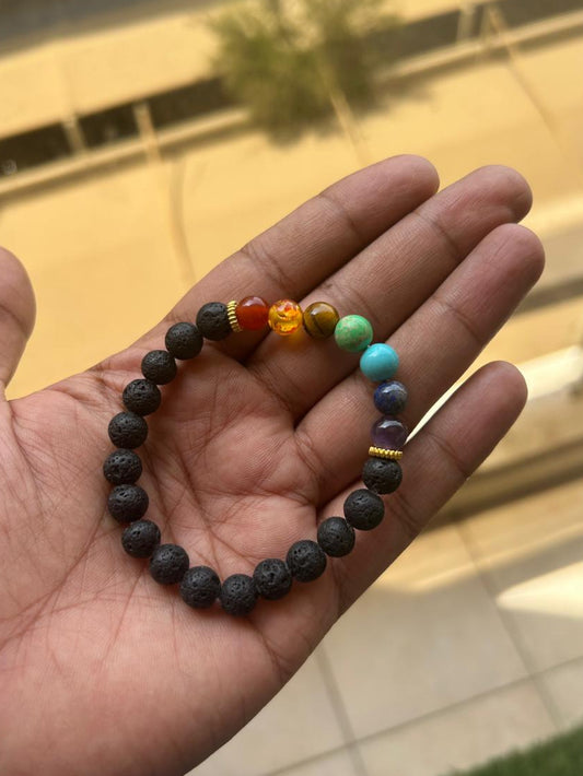 7 chakra natural bracelet with lava stones and colorful gemstones representing each chakra.