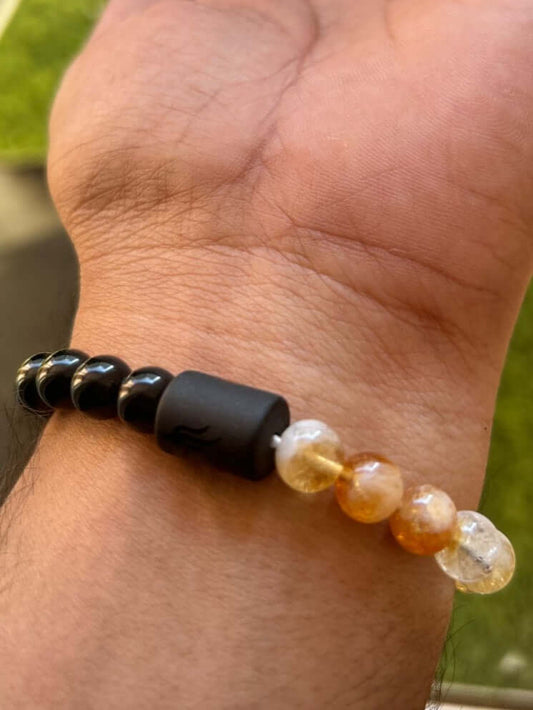Hand wearing Citrine Pyrite Black Obsidian Bracelet – bracelet for wealth, protection, and grounding